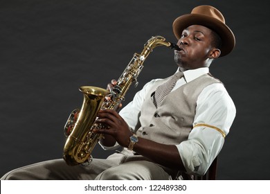 Black american jazz saxophone player. Vintage. Studio shot. Stock Photo