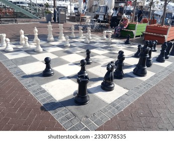 Life Size Chess Pieces On A Board Outside At A Hotel Pool Side Stock Photo  - Download Image Now - iStock