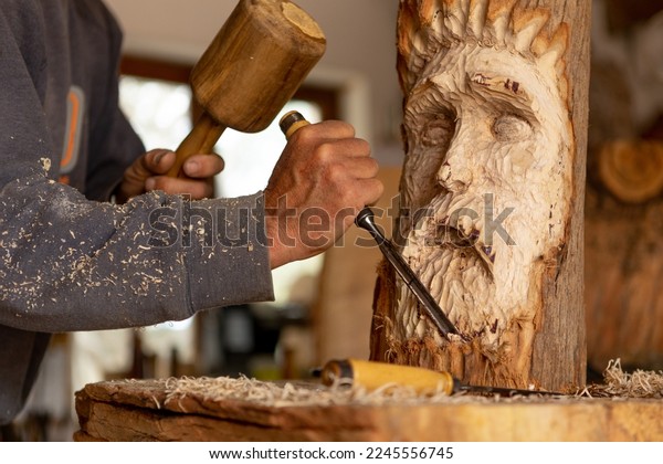 https://www.shutterstock.com/image-photo/closeup-artisan-wood-worker-sculpting-600w-2245556745.jpg