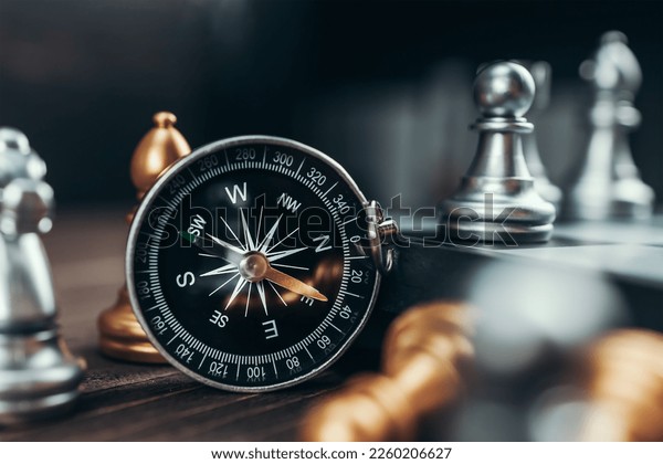 Chess, chess pieces, compass Stock Photo - Alamy