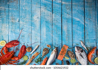 Fresh tasty seafood served on old wooden table. Top view. Close-up. Stock Photo