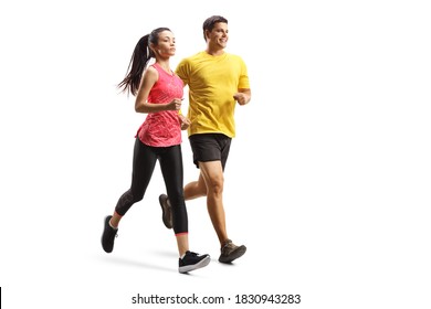 Full length shot of a young man and woman in sportswear jogging isolated on white background Foto stock