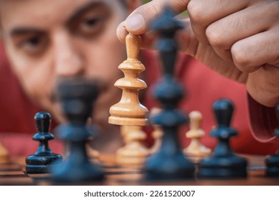 man studying the next chess move Stock Photo - Alamy