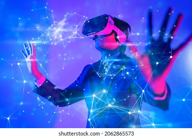 Metaverse digital cyber world technology, man with virtual reality VR goggle playing AR augmented reality game and entertainment, NFT game futuristic lifestyle: zdjęcie stockowe