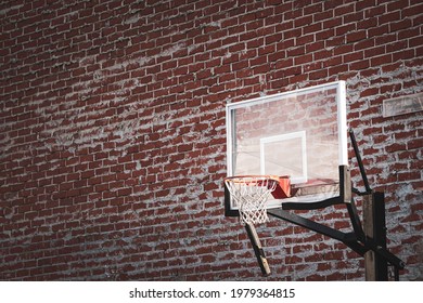Urban basketball hoop in alley with brick wall Stock Photo