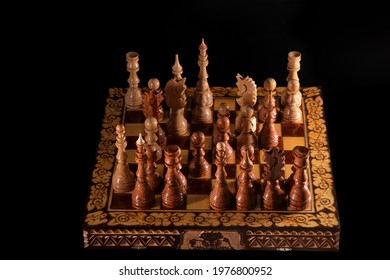 Ancient wooden chess pieces on an old chessboard Stock Photo - Alamy