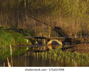 Makeshift wooden bridge over water Stock Photo - Alamy
