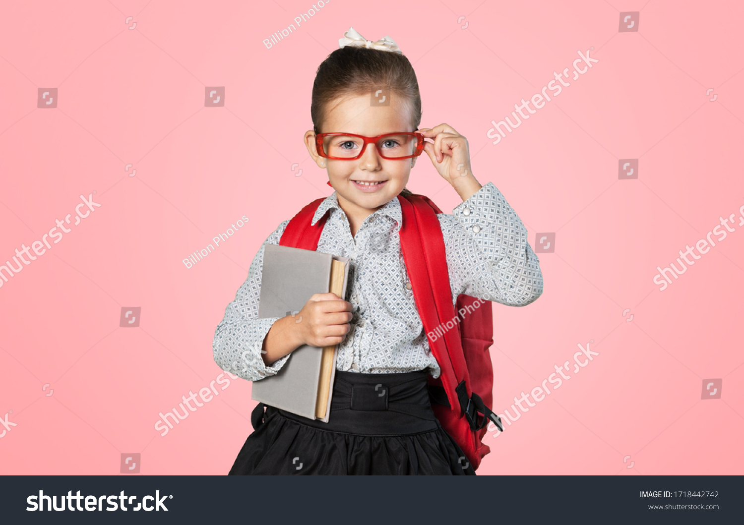 Clever Child Holding Textbook Looking Camera Stock Photo 1718442742