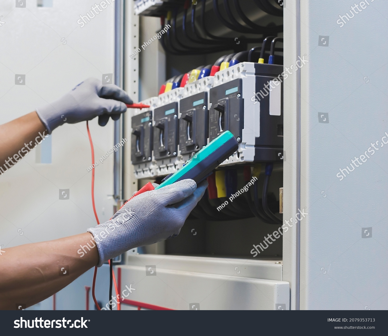 Electrical Engineers Check Electrical Control Devices Stock Photo